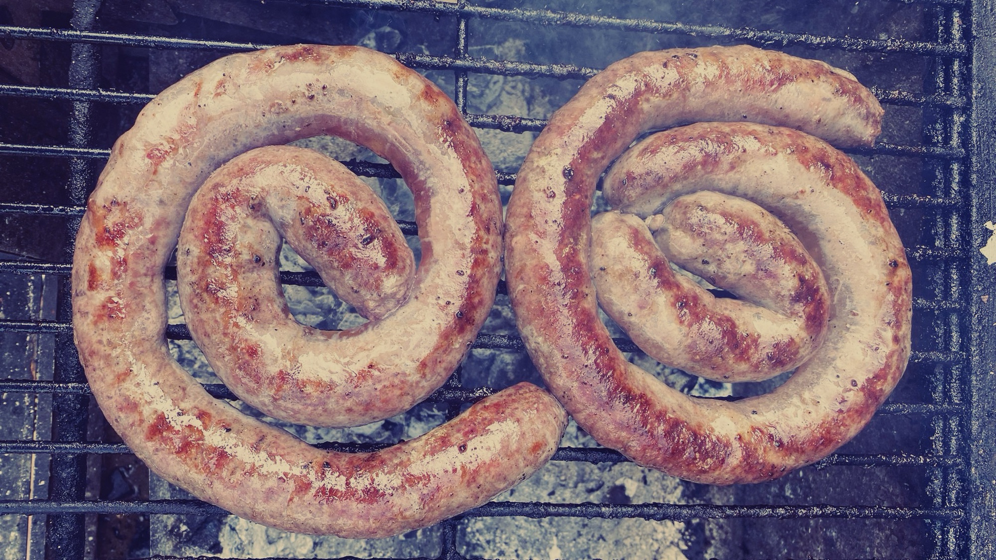 Boerewors cooking on the braai